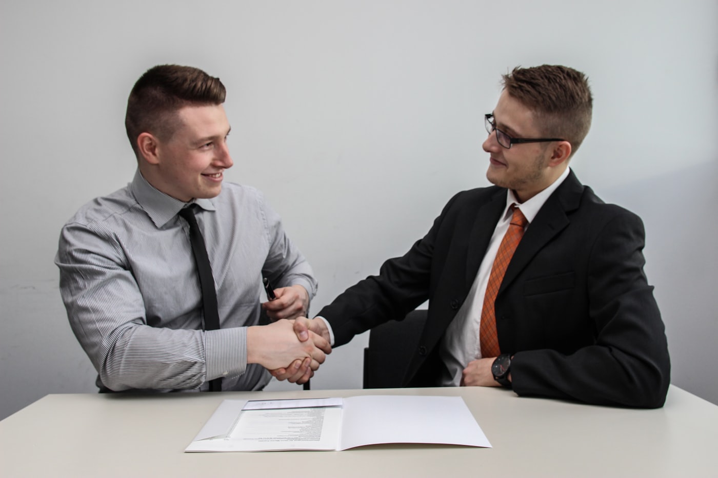 Two people meeting and shaking hands