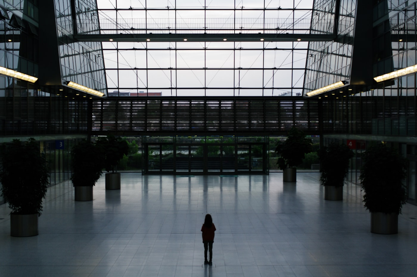 A person standing alone in a large open space