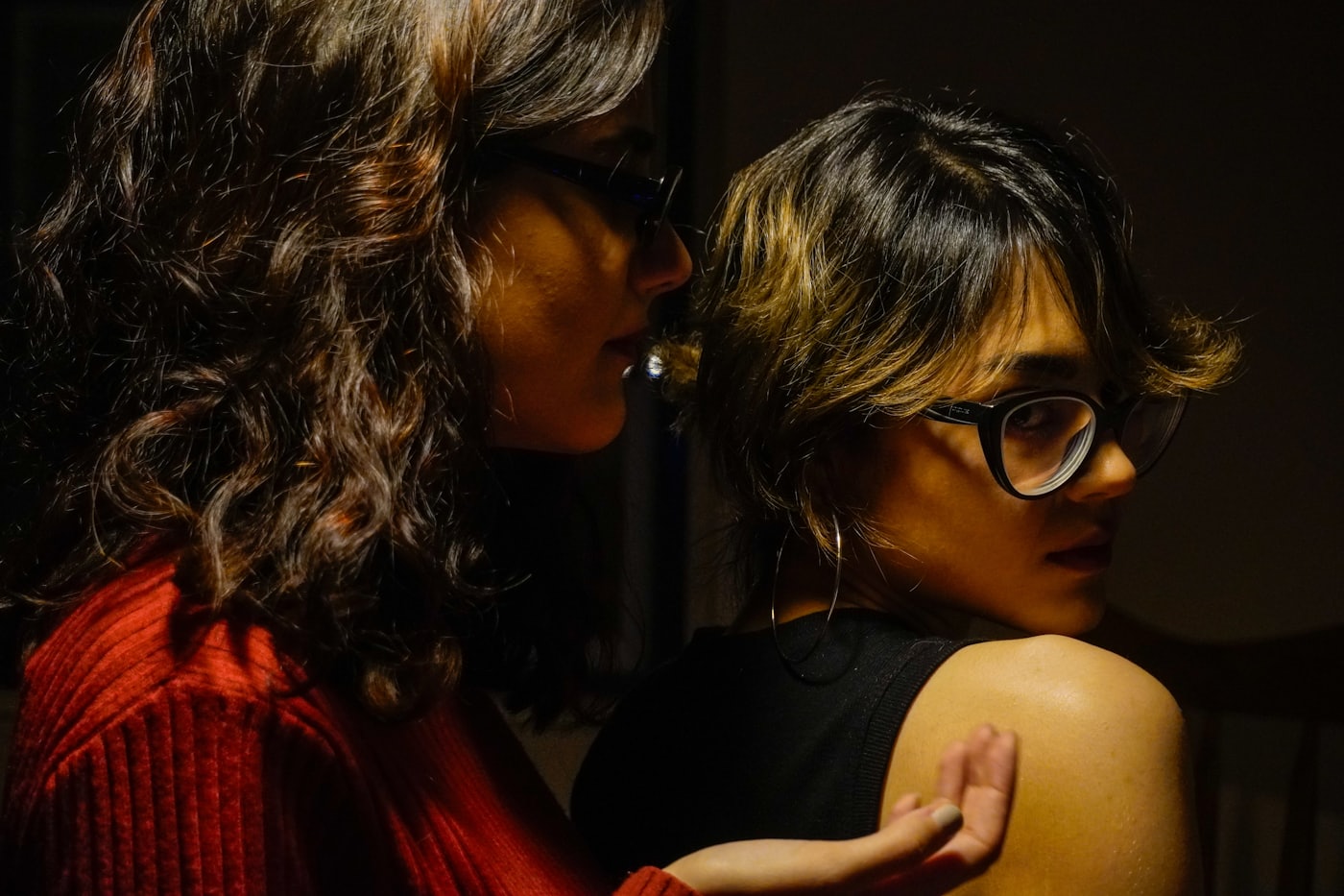 Two people in close, intimate conversation